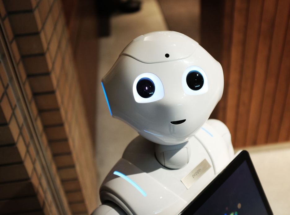 A futuristic humanoid robot in an indoor Tokyo setting