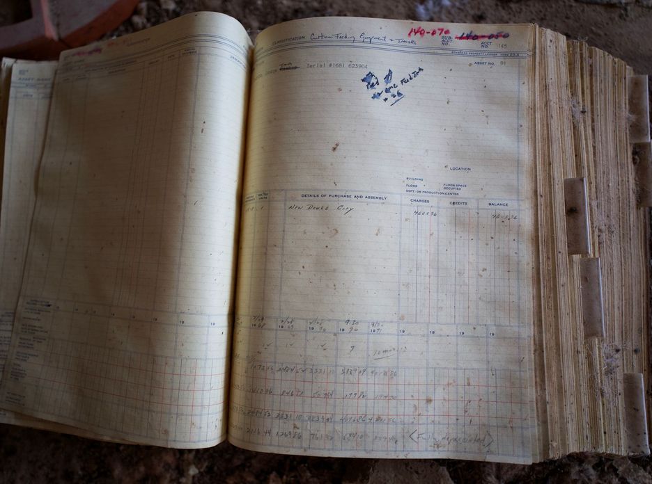 An old handwritten account ledger lying open