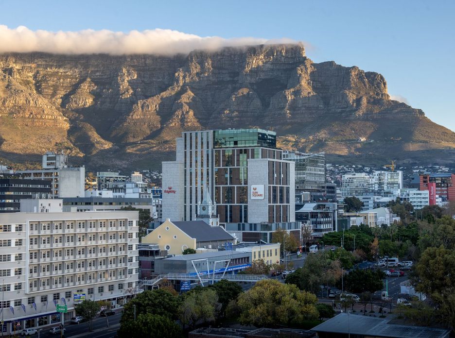 Urban view of Cape Town with Table Mountain at sunrise